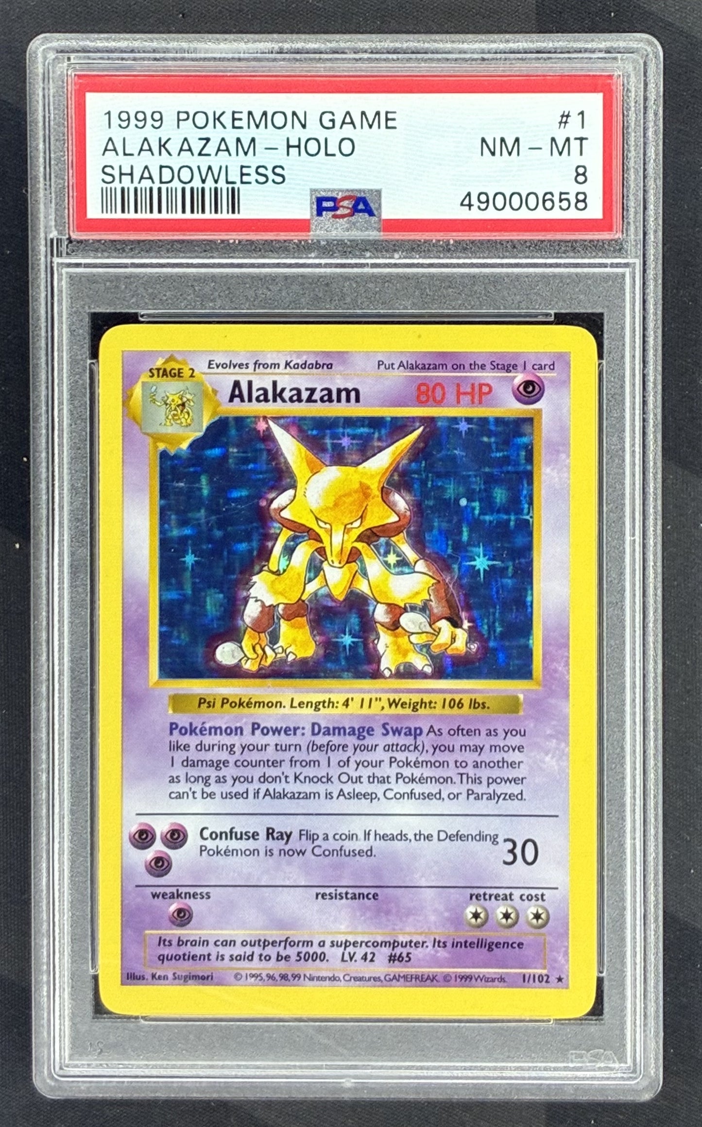 1999 Pokémon Shadowless Base Set Alakazam Holo 1/102 card graded PSA 8 by PSA.
