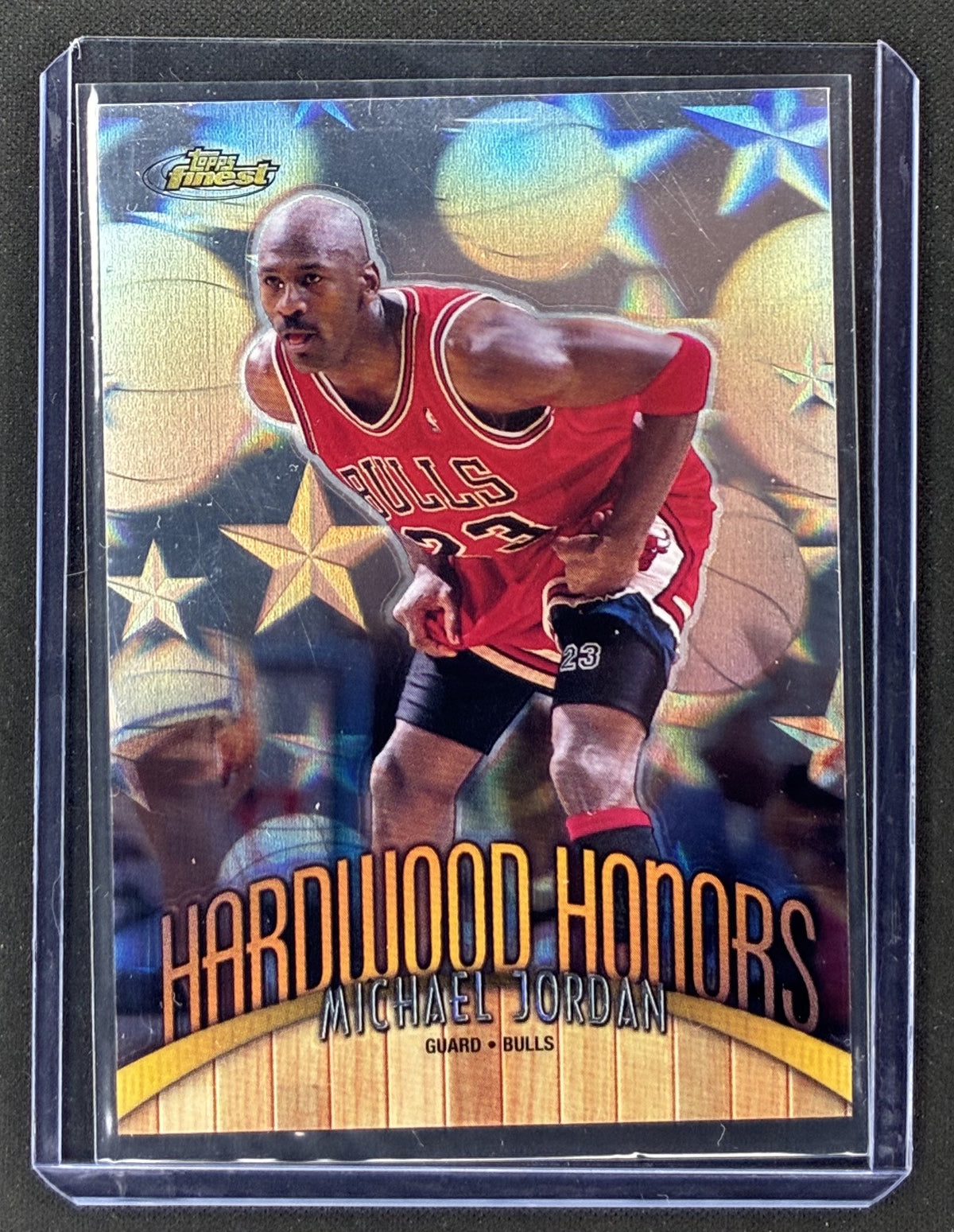 1998-99 Topps Finest Michael Jordan Hardwood Honors #H1 Chicago Bulls insert card with visible surface scratches.