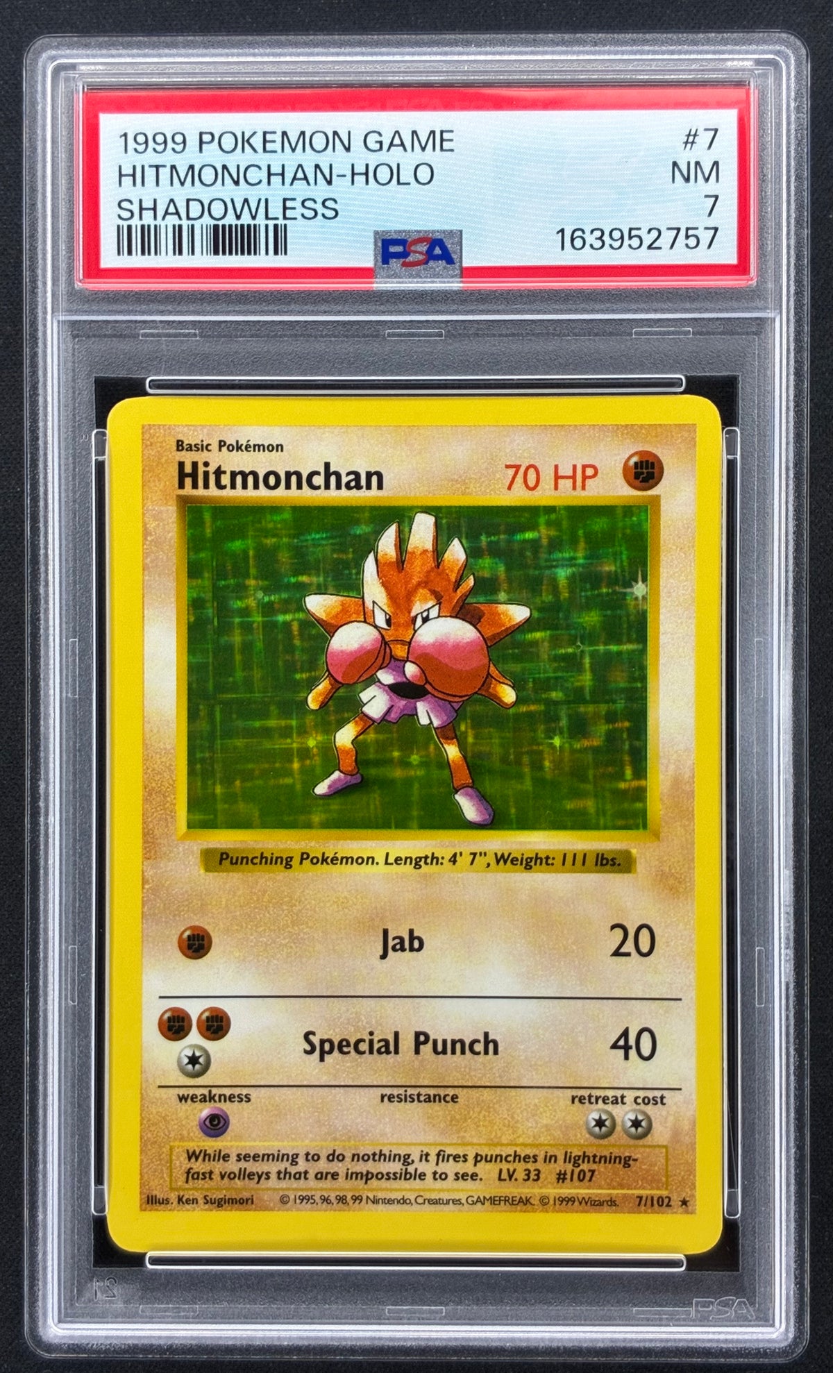 PSA slab front — 1999 Pokémon Shadowless Base Set Hitmonchan Holo 7/102 PSA 7 Near Mint