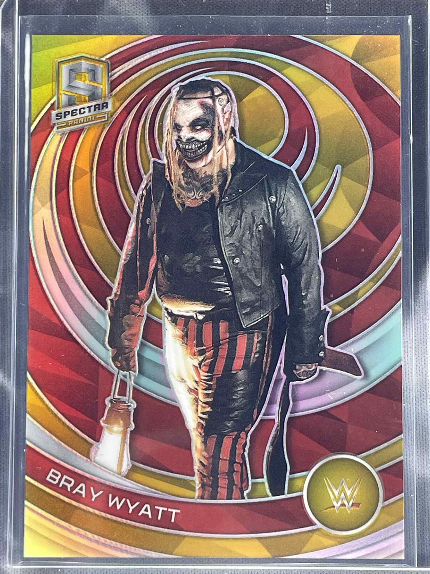 “2023 Panini Spectra WWE Bray Wyatt Gold /10 #393 trading card.”