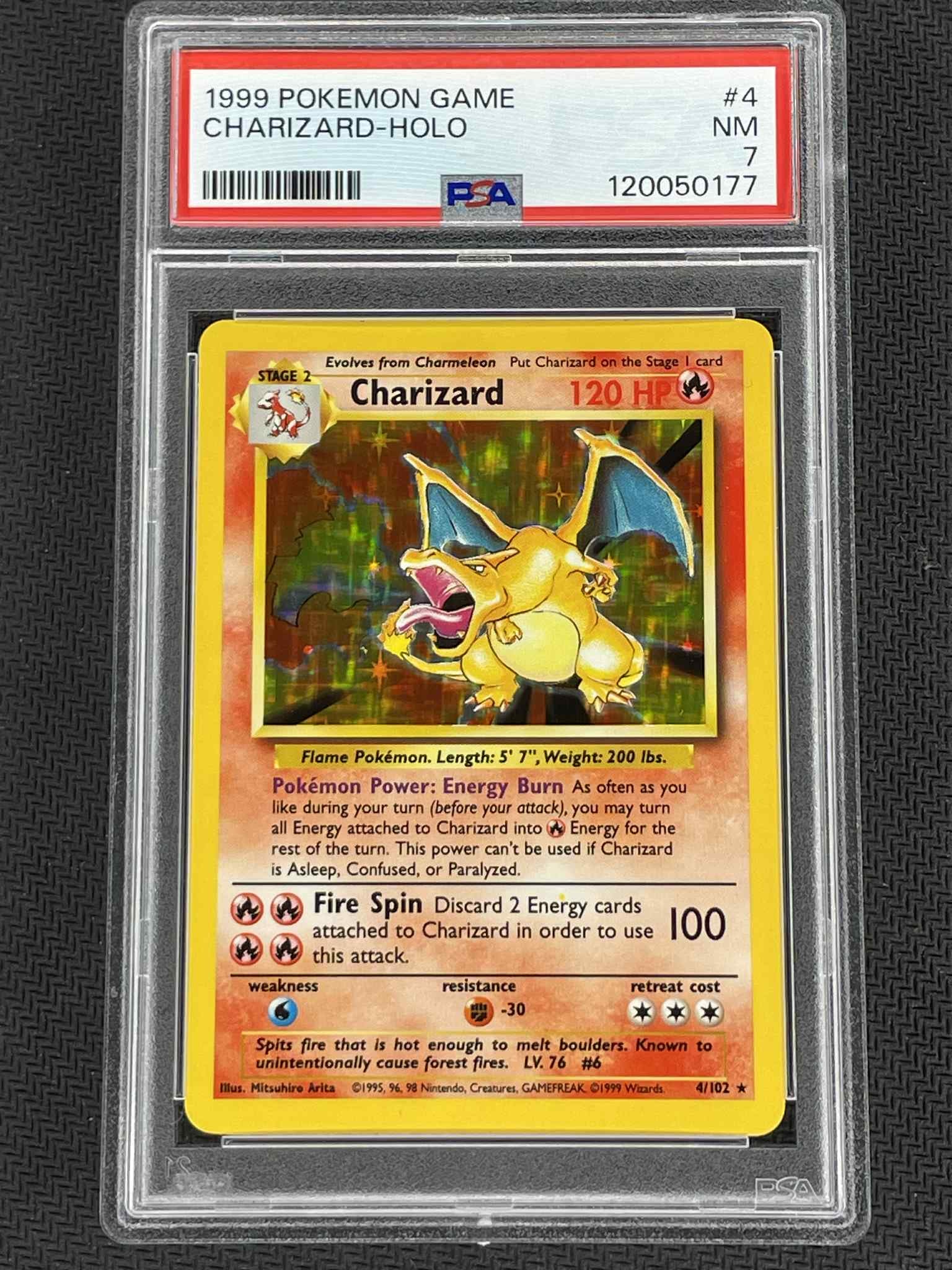 Pokémon Charizard card in a protective case with PSA grading label