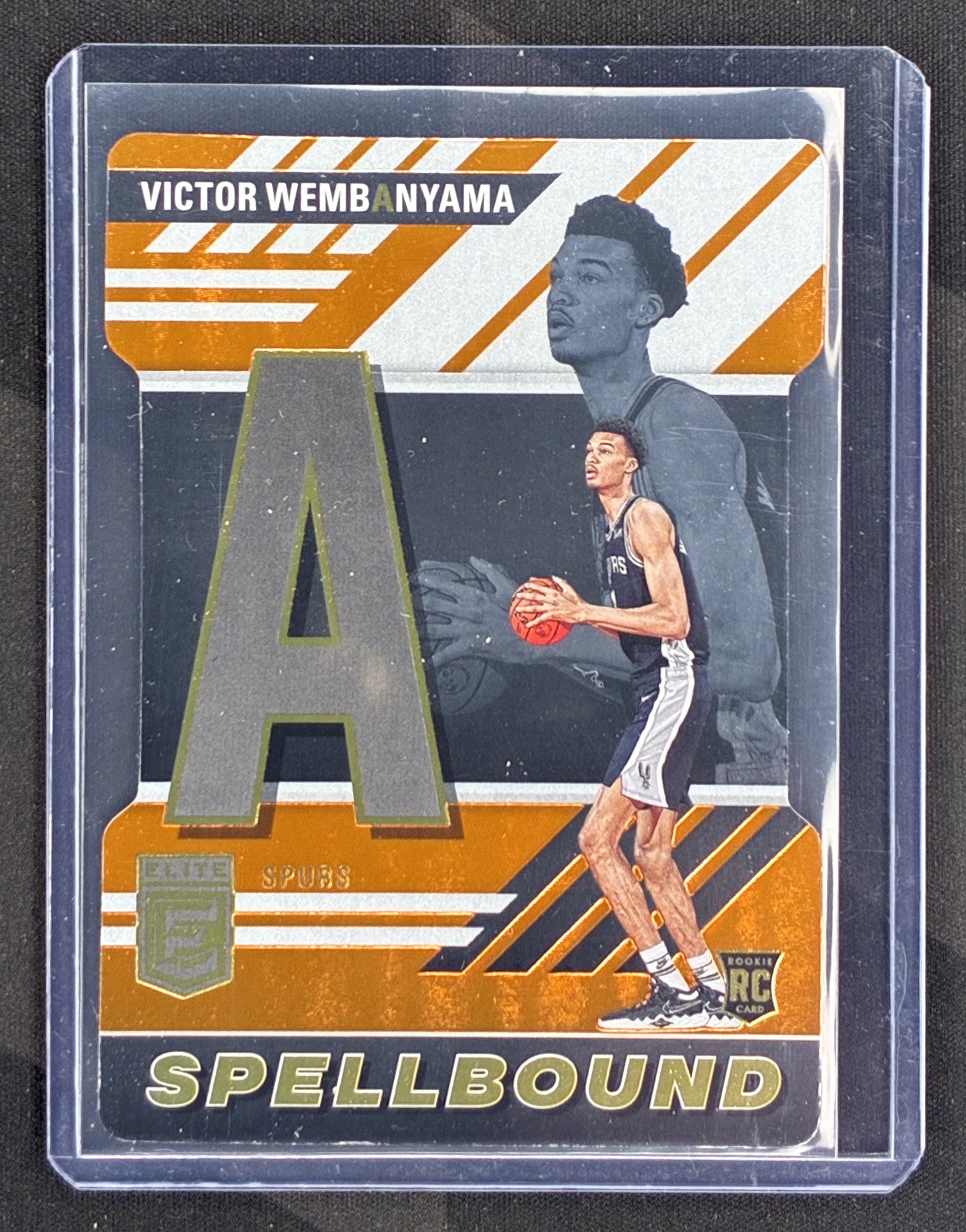 2023-24 Panini Donruss Elite Victor Wembanyama Spellbound Orange Die-Cut Rookie RC San Antonio Spurs basketball card.