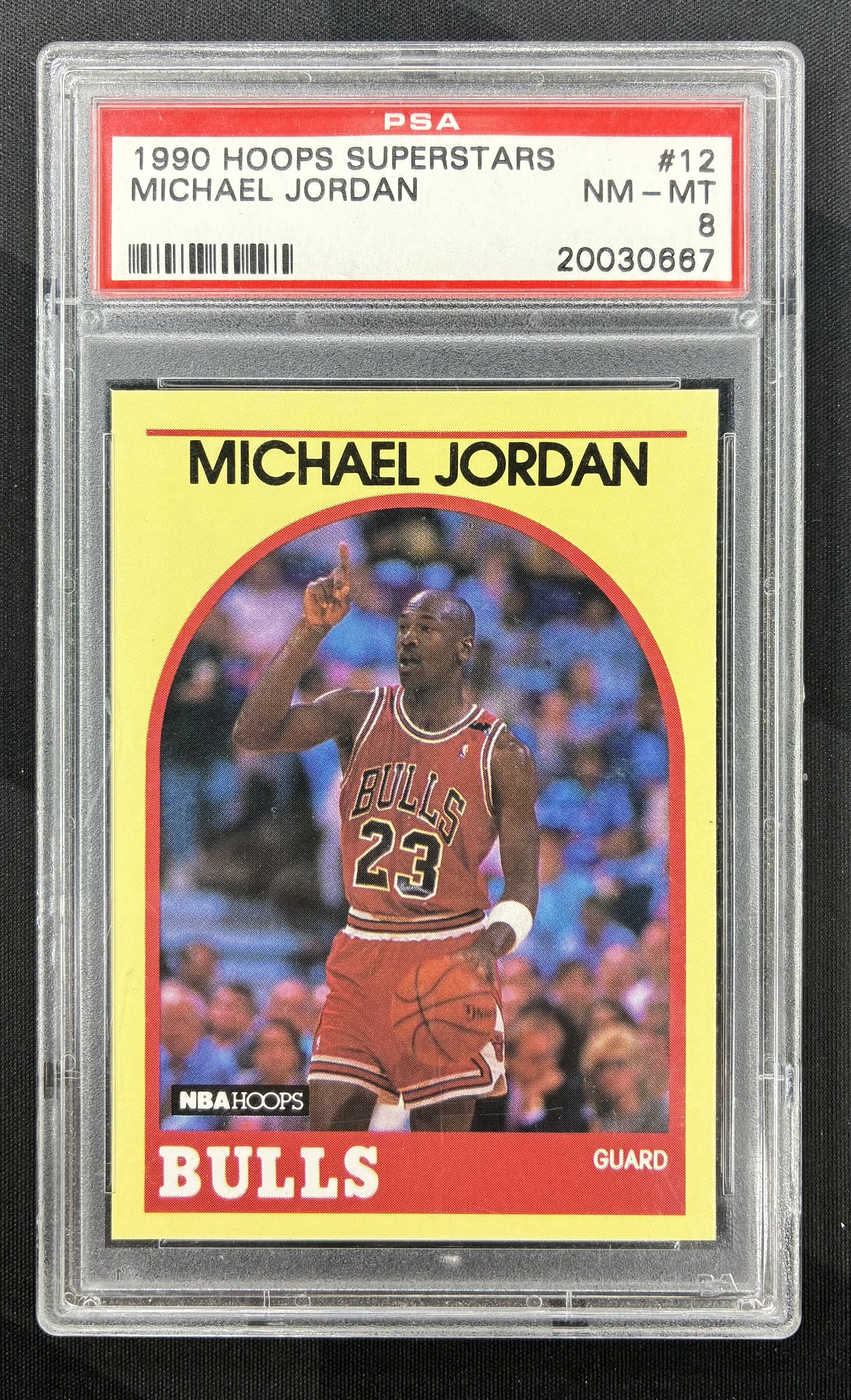 1990 Hoops Superstars Michael Jordan #12 Yellow Chicago Bulls basketball card professionally graded PSA 8 NM-MT.