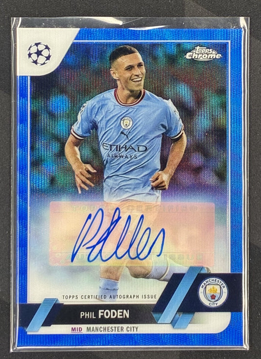 2022 Topps Chrome UEFA Club Competitions Phil Foden Blue Wave Refractor autograph card numbered to 75.