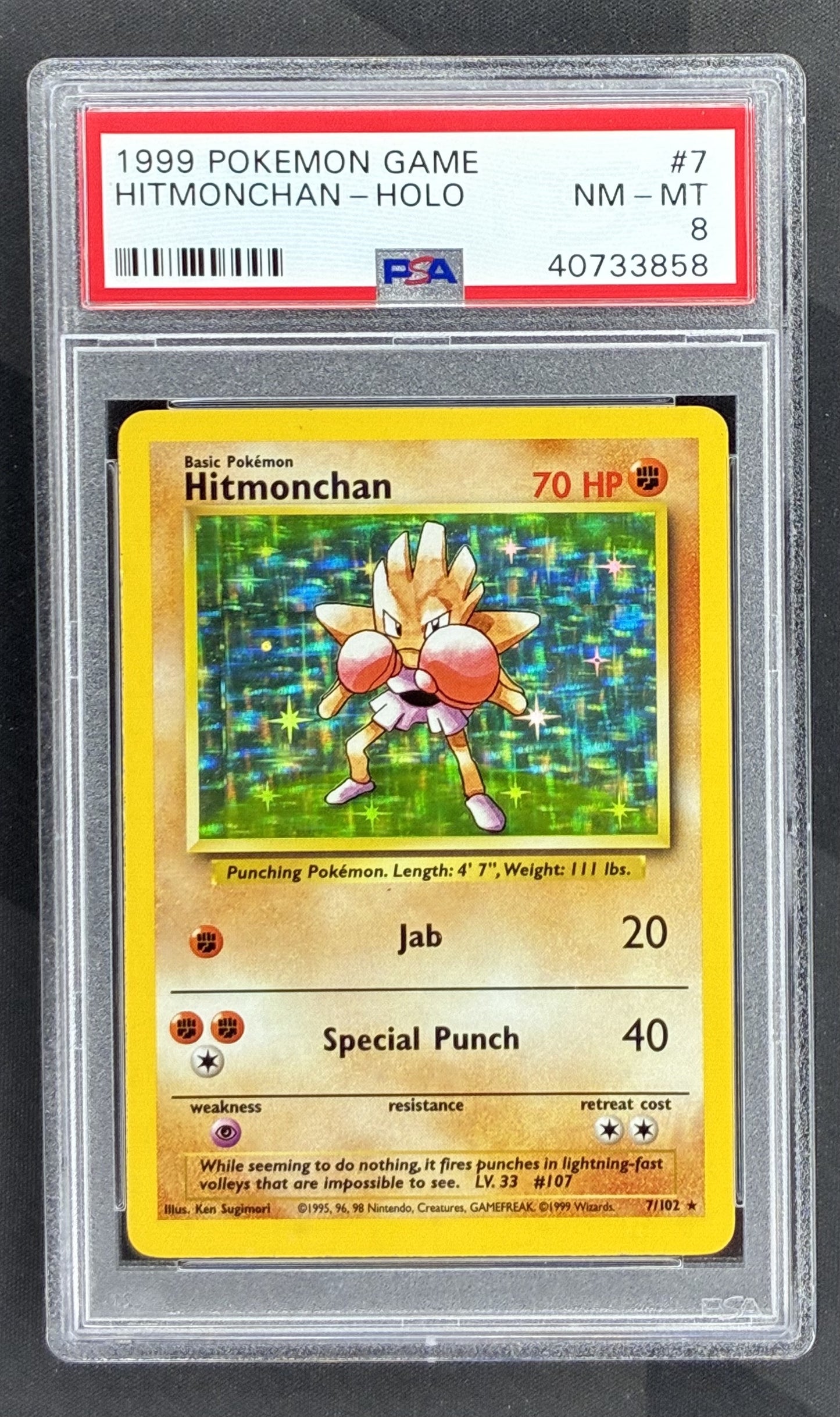 1999 Pokémon Base Set Hitmonchan Holo Rare 7/102 vintage Wizards of the Coast card graded PSA 8 Near Mint-Mint.