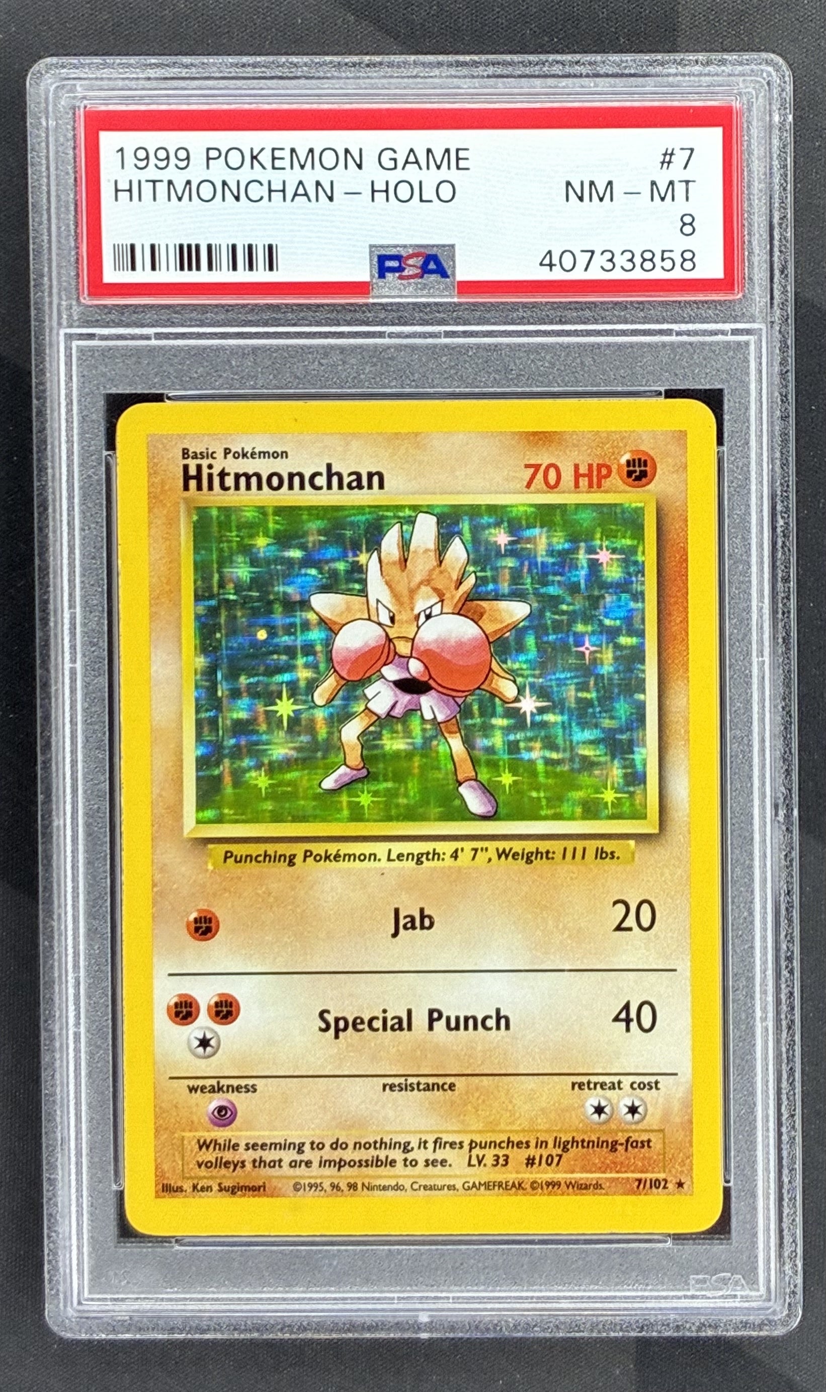 1999 Pokémon Base Set Hitmonchan Holo Rare 7/102 vintage Wizards of the Coast card graded PSA 8 Near Mint-Mint.
