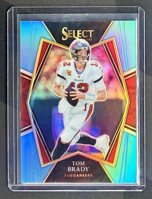 2021 Panini Select Tom Brady Premier Level Light Blue Prizm numbered to 99 NFL trading card in Near Mint condition.