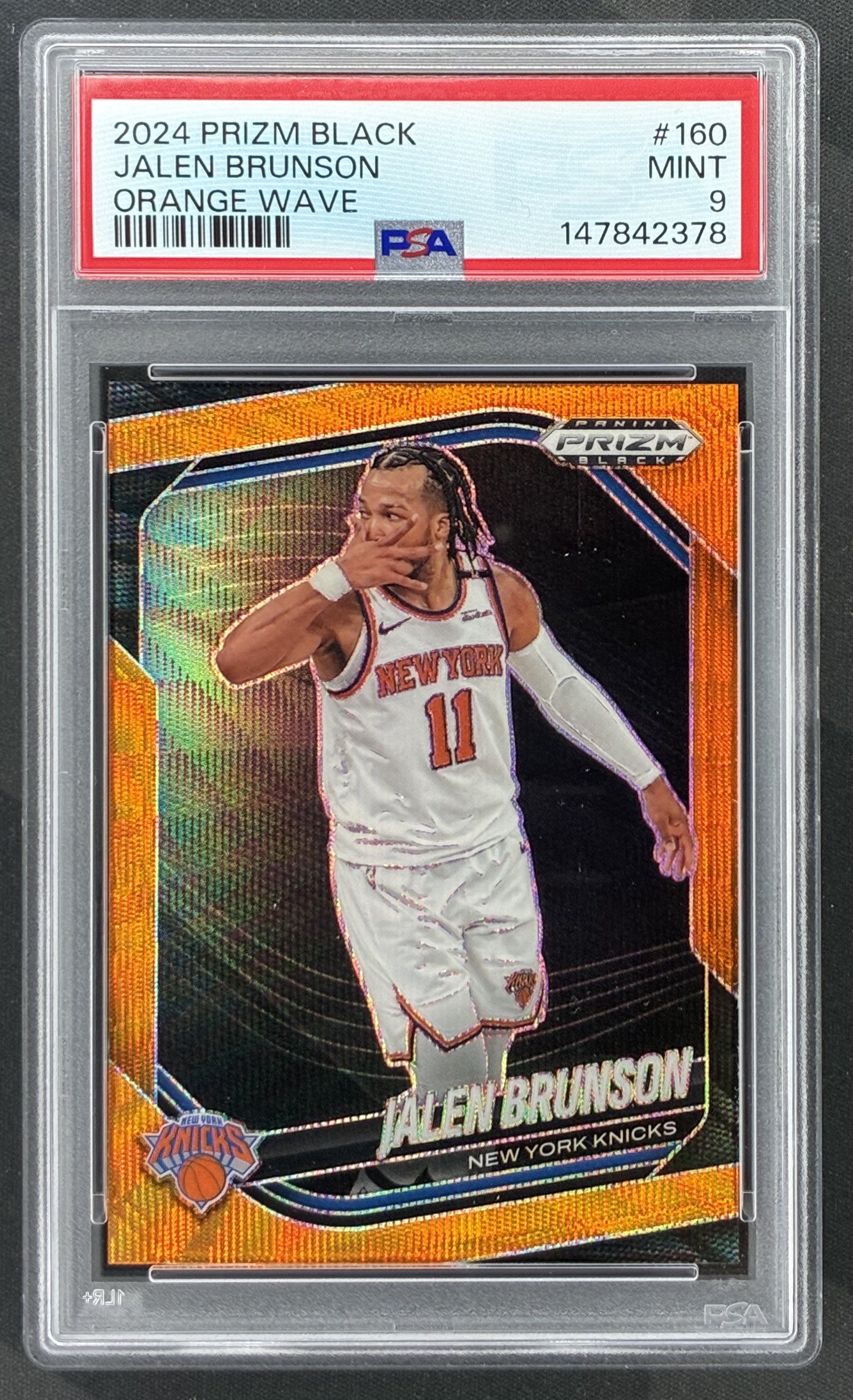 2024-25 Panini Prizm Black Jalen Brunson Orange Wave Prizm numbered to 60 graded PSA 9 Mint.