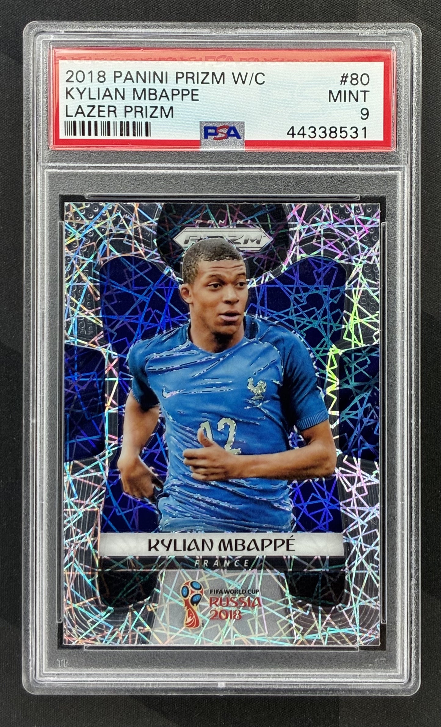 2018 Panini Prizm FIFA World Cup Kylian Mbappé Rookie Card #80 Lazer Prizm graded PSA 9 Mint.