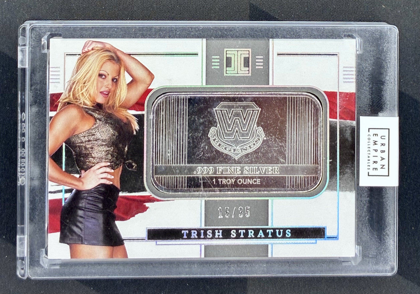 2022 Panini Impeccable WWE Trish Stratus Silver WWE Legends Logo #18 one troy ounce silver card numbered /35.
