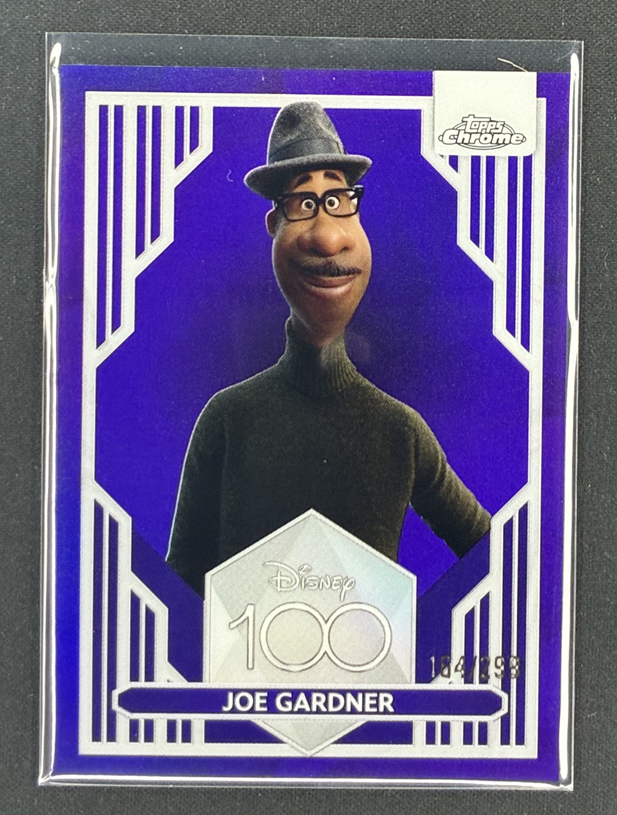 2023 Topps Chrome Disney 100 Joe Gardner number 64 Purple Refractor serial numbered to 299.