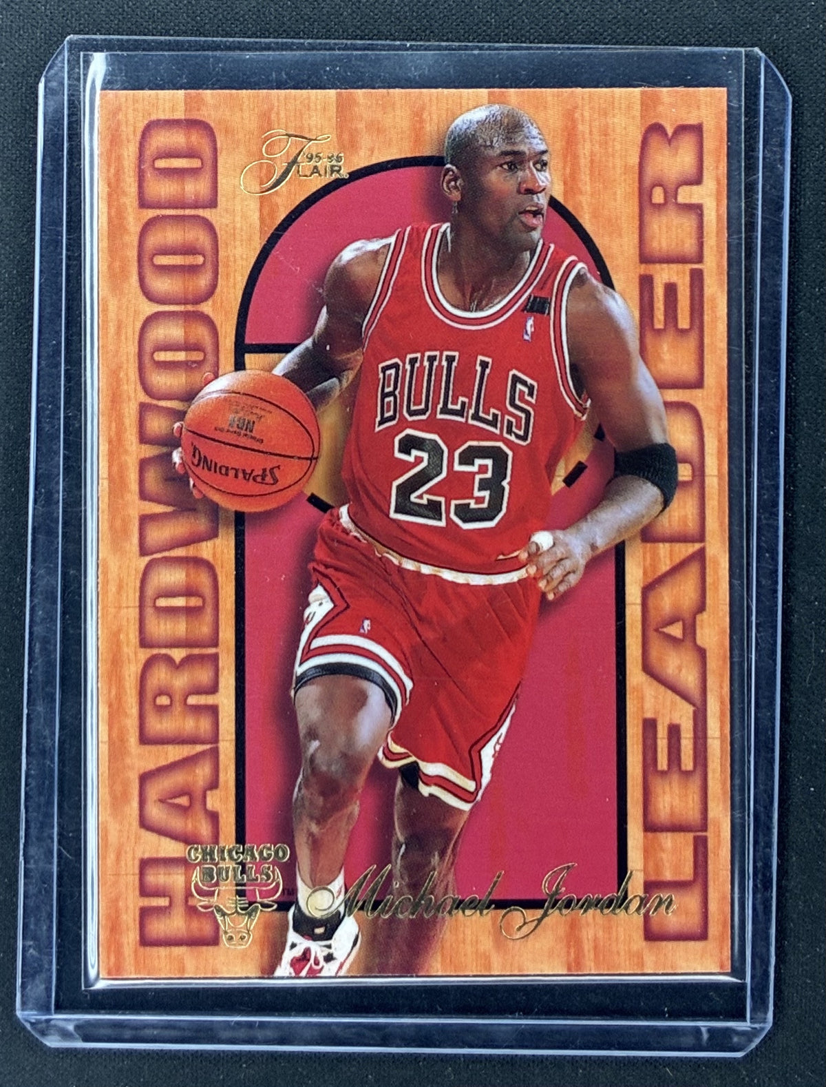 1995-96 Fleer Flair Michael Jordan Hardwood Leader #4 of 27 Chicago Bulls insert featuring premium card stock and gold foil detailing.