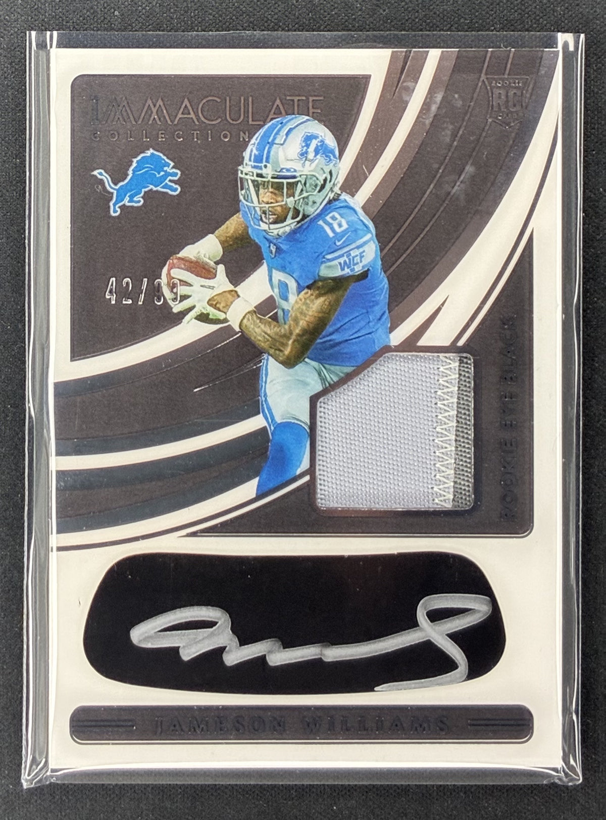 2022 Panini Immaculate Jameson Williams Rookie Eye Black Jersey autograph #7 numbered /99 Detroit Lions.