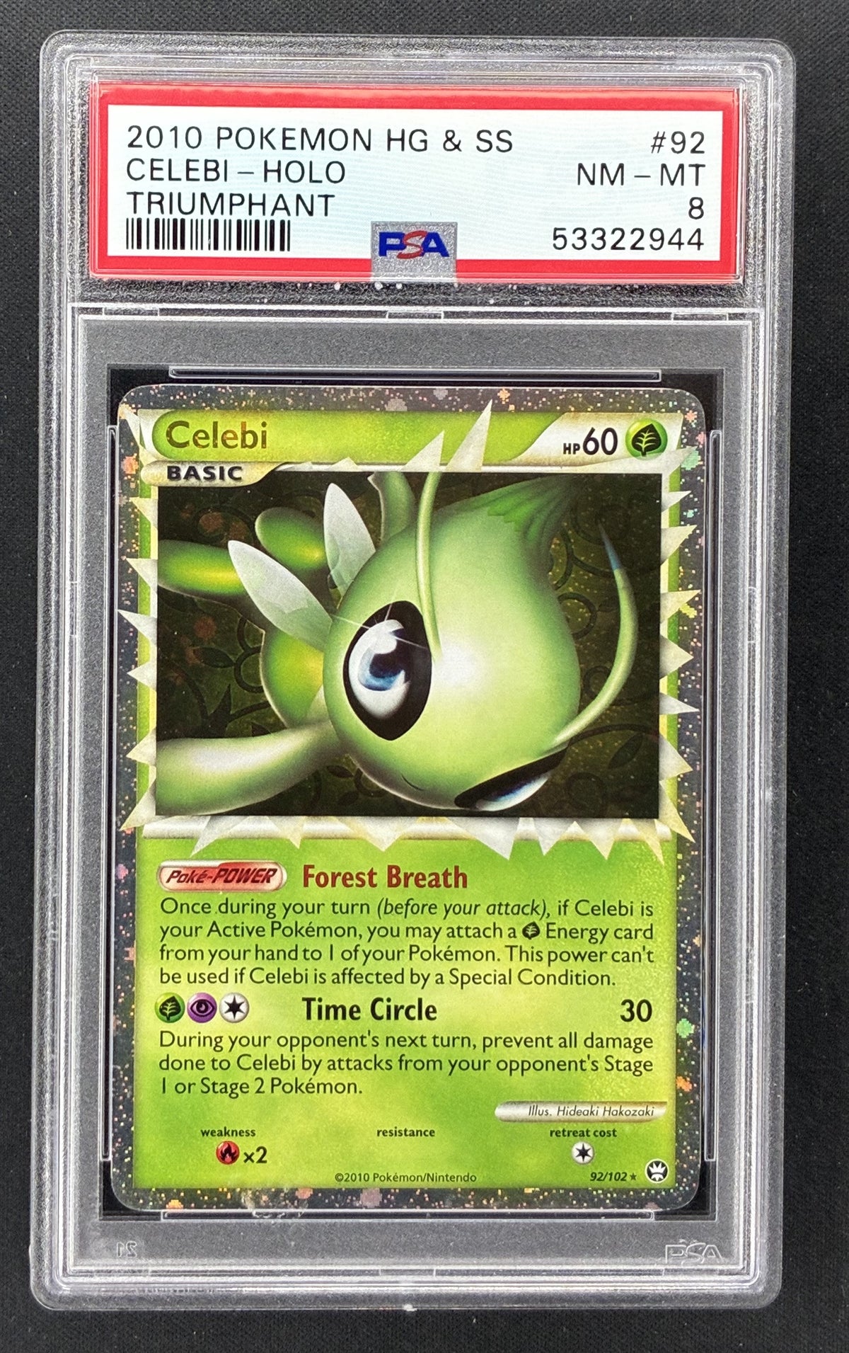 2010 Pokémon HS Triumphant Celebi Prime Holo #92/102 PSA 8 NM-MT English trading card.