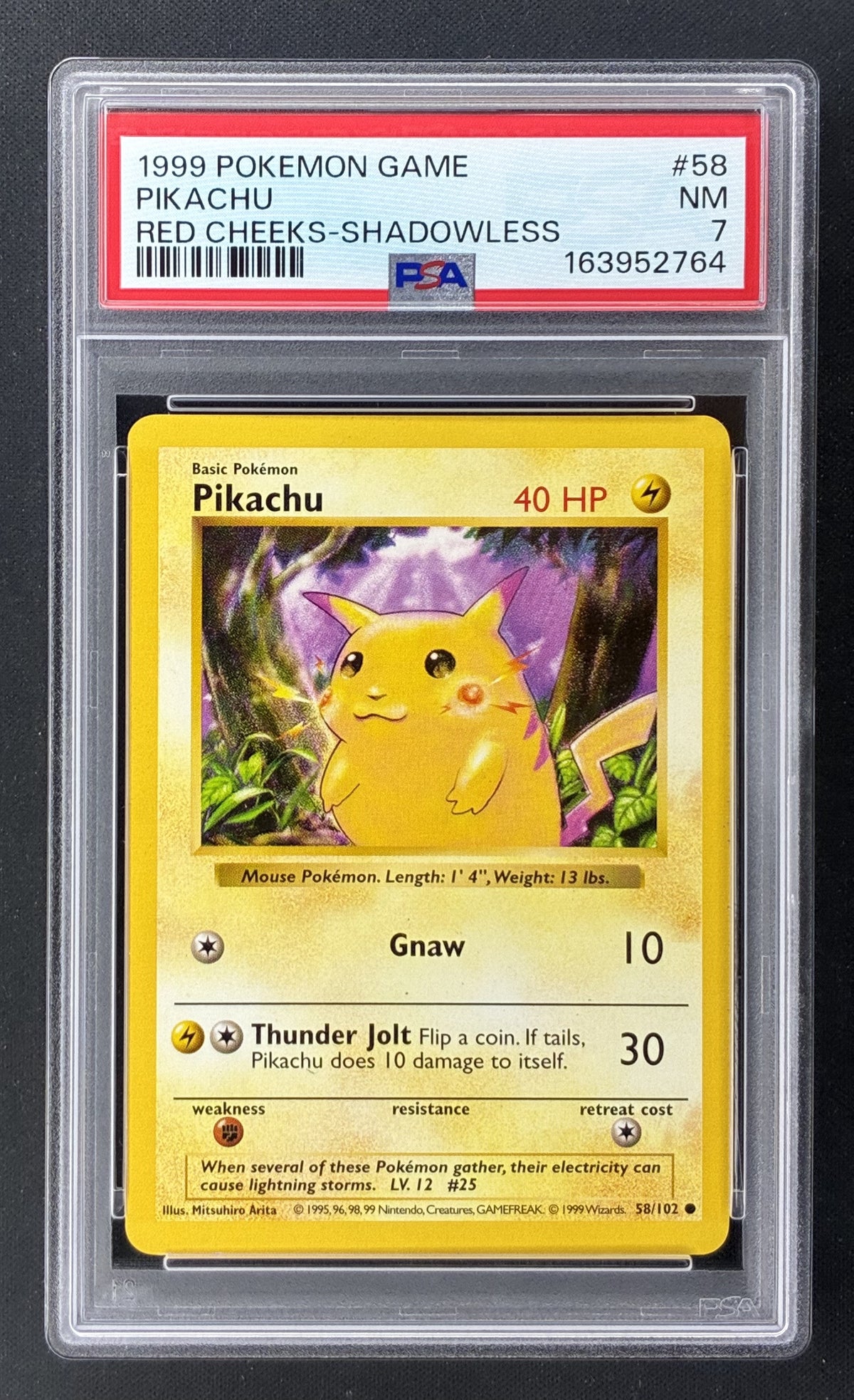 1999 Pokémon Base Set Shadowless Red Cheeks Pikachu 58/102 PSA 7 Near Mint.