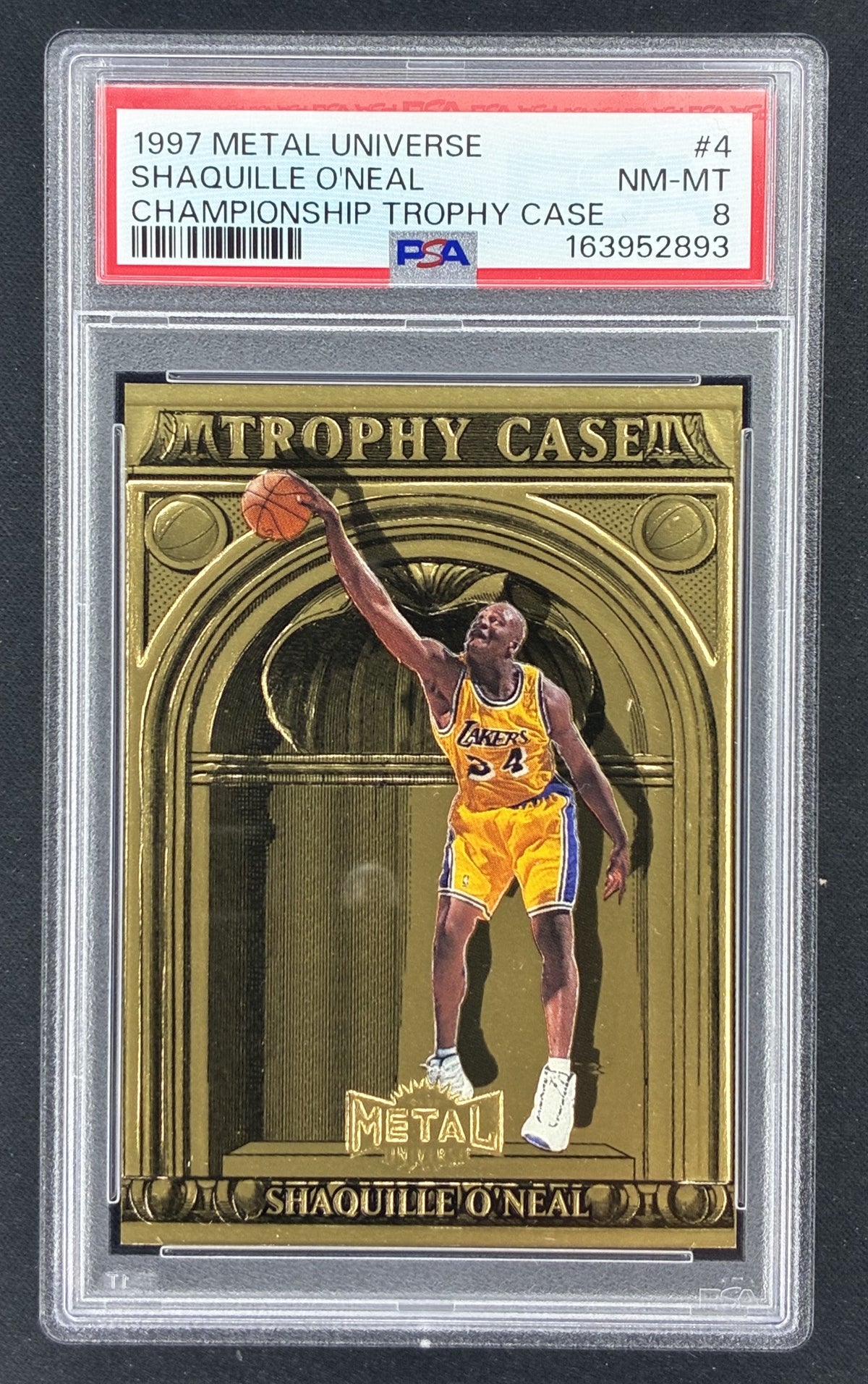 1997-98 Fleer Metal Universe Championship Shaquille O'Neal Trophy Case #4 basketball insert featuring the Los Angeles Lakers Hall of Famer, graded PSA 8 Near Mint-Mint.