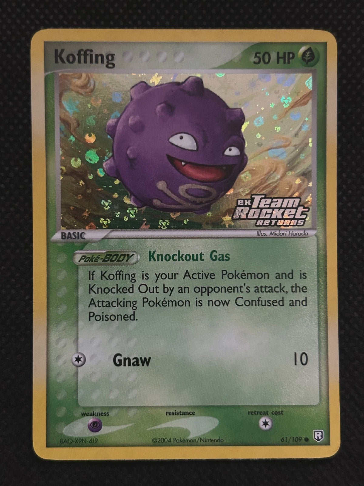 2004 Pokémon Koffing 61/109 EX Team Rocket Returns Reverse Holo Stamped English card in Lightly Played condition.